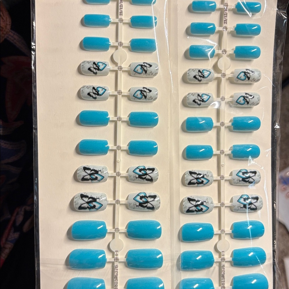 Two (2) Sets of Press on Nails Medium length